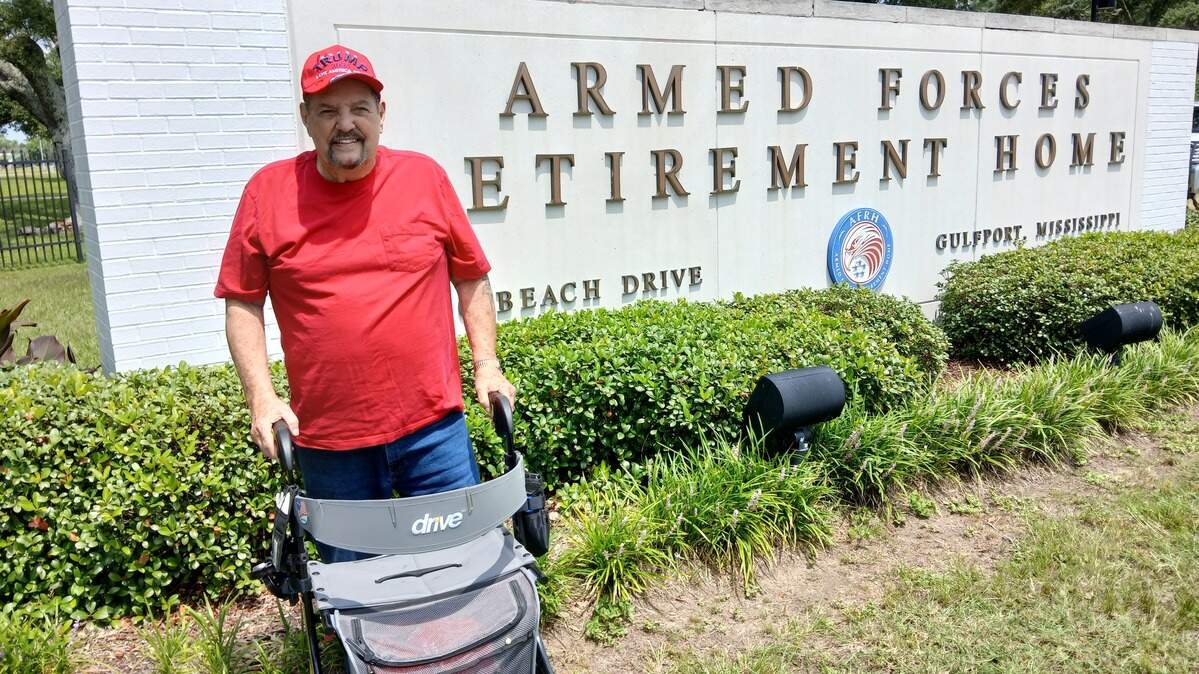 Johnny Fuselier, a Vietnam veteran, retired from the Navy and has lived for 10 years at the Gulfport Armed Forces Retirement Home. He has filed a federal lawsuit against AFRH management for the right to wear political slogans and post them on his walker.