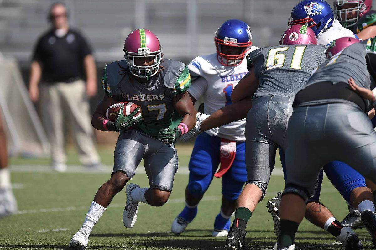 The Belhaven Blazers bring breast cancer awareness to an entirely new level with those helmets.