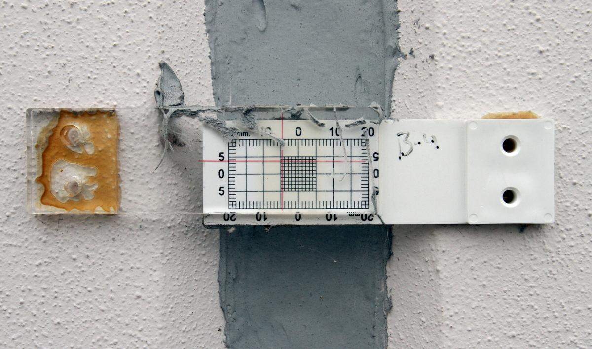 Several measuring devices were attached to the rear wall of the building housing Dick’s Sporting Goods at The Promenade shopping center in D’Iberville after settling issues were discovered in 2011.