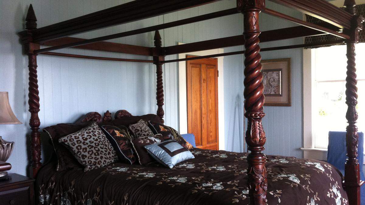 TAMMY SMITH/SUN HERALDFamily members have contributed many of the furnishings in the Anderson home, as in this bedroom called 'the blue room.'