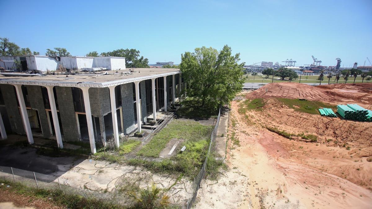 Coast Transit Authority is about to transform the old downtown library into a transit center, with plans for a bridge that would cross U.S. 90 to Jones Park, the harbor and the beach. The bridge would serve pedestrians, trams and bicyclists.