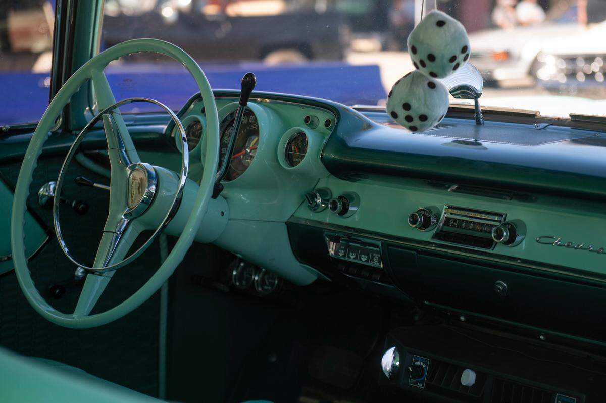 Fuzzy dice hang from the rear view mirror of a car during Cruisin’ The Coast in 2022. Waveland is returning for the first time in 17 years, getting in on the block party and the economic impact.