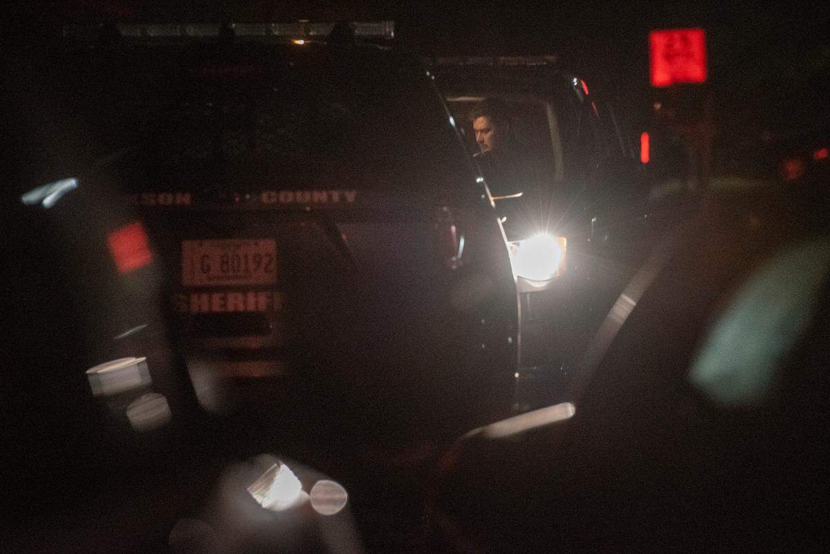 Police officers parked outside a home on Oakview Circle in Latimer on Thursday, April 7, 2022 after a fatal shooting.