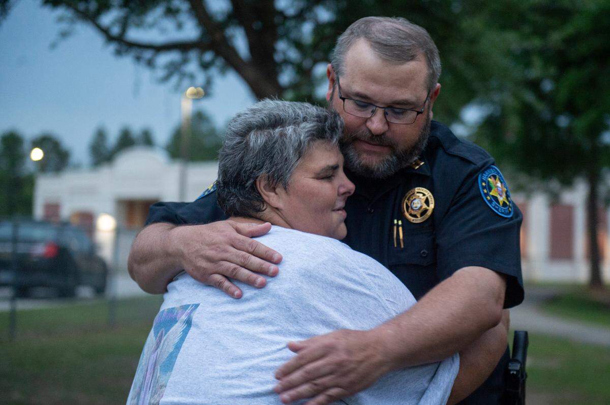 Vickie Wedgeworth Hutcherson, the mother of Gracelynn Vick, hugs Harrison County Sheriff’s Department Captain Teddy Rose, who helped search for Gracelynn, during a candlelight vigil for Gracelynn at Saucier Park on Tuesday, April 22, 2025.