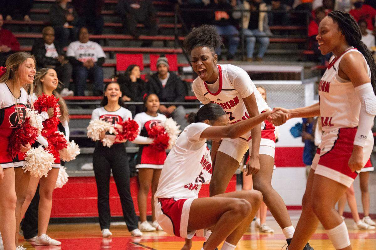 Harrison Central’s Hayleigh Breland, right, and Laila Walker, center, help up Anaisha Carriere after she was fouled by Gulfport during a game against Gulfport at Harrison Central High School in Gulfport on Friday, Feb. 4, 2022.
