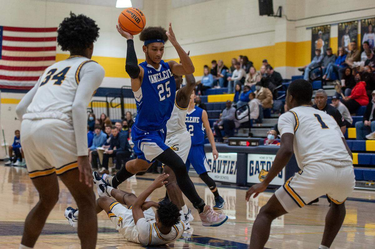 Vancleave forward Oscar Hampton jumps over Gautier’s defense during a game against Gautier at Gautier High School in Gautier on Friday, Jan. 21, 2022.