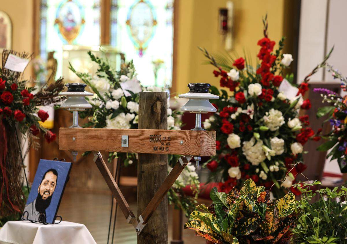 A power line poll was positioned next to Cayce Seal’s casket during his funeral services at St. Clare Catholic Church in Waveland on July 1, 2021.