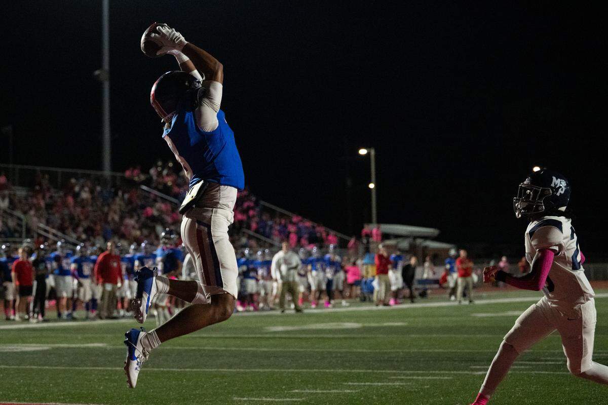 Pass Christian wide receiver Larkin Lewis (8) goes high to haul in a touchdown pass Friday.
