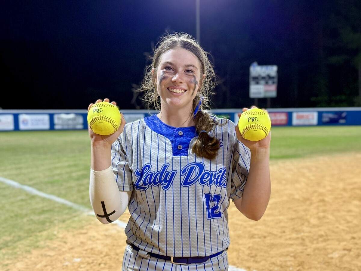 Pearl River Central’s Addison Davis holds up two softballs after hitting a pair of home runs on April 23, 2026.