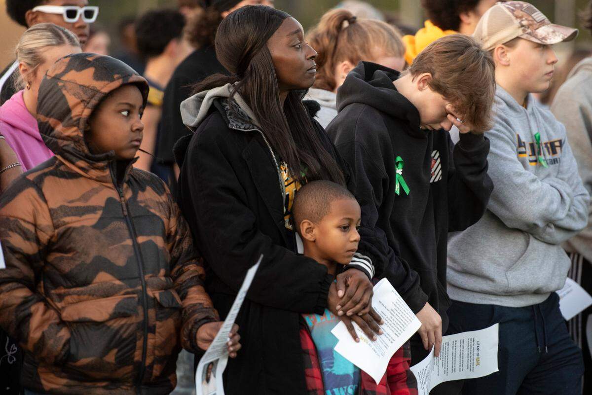 Mourners react during a vigil for Gautier High School student Shermarion Miner at Gautier High School on Thursday, Jan. 16, 2025.