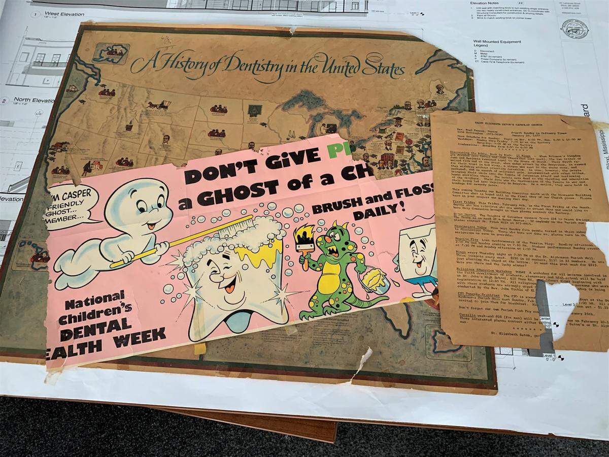 A Casper the Ghost poster to remind children to brush is one of the papers left behind and discovered during the interior demo of the Barq Building in Biloxi.