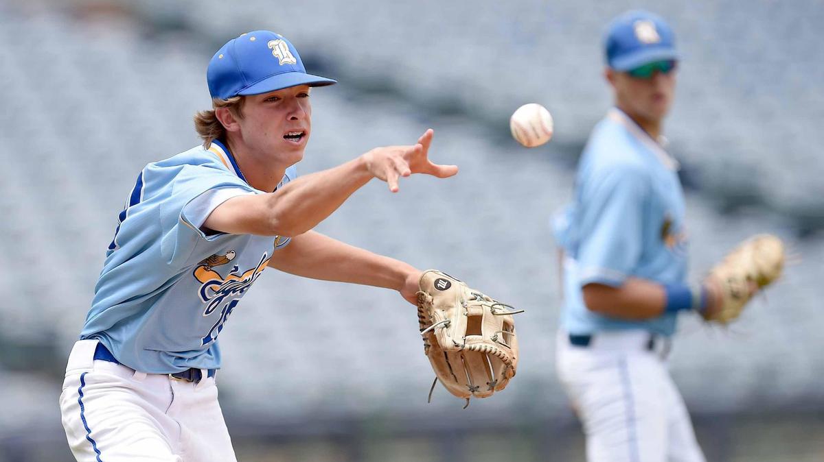 Resurrection Catholic’s Cole Tingle flips the ball to first base to retire a Tupelo Christian base runner at the MHSAA State Baseball Championships at Trustmark Park in Pearl, Miss., on Tuesday, June 1, 2021.