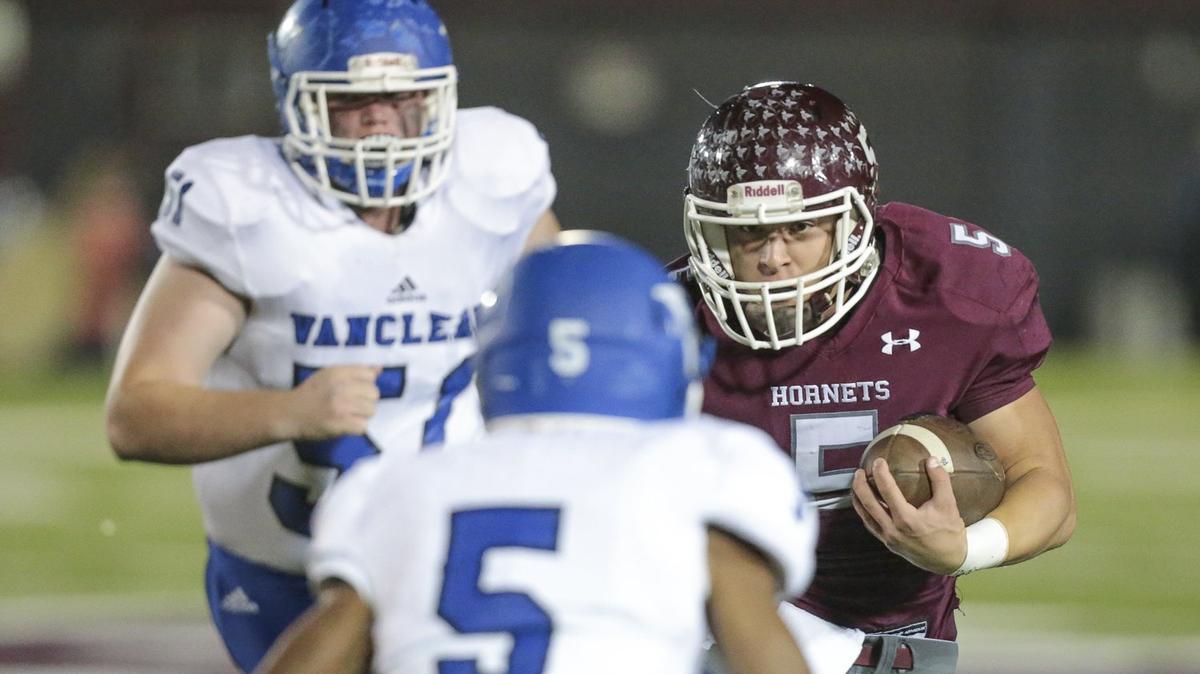 East Central quarterback Will Young (5) is met by Antwone Booker (5) after a short gain during the game between Vancleave and East Central at East Central, Friday, October 26, 2018. (Photo: Bobby McDuffie / Special to the Sun Herald)