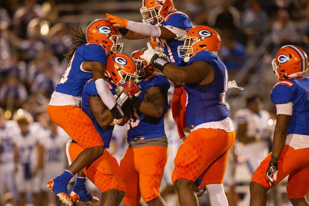 Gulfport players celebrate an interception during a game against Ocean Springs at Milner Stadium in Gulfport on Friday, Oct. 27, 2023. Ocean Springs beat Gulfport 30-7.