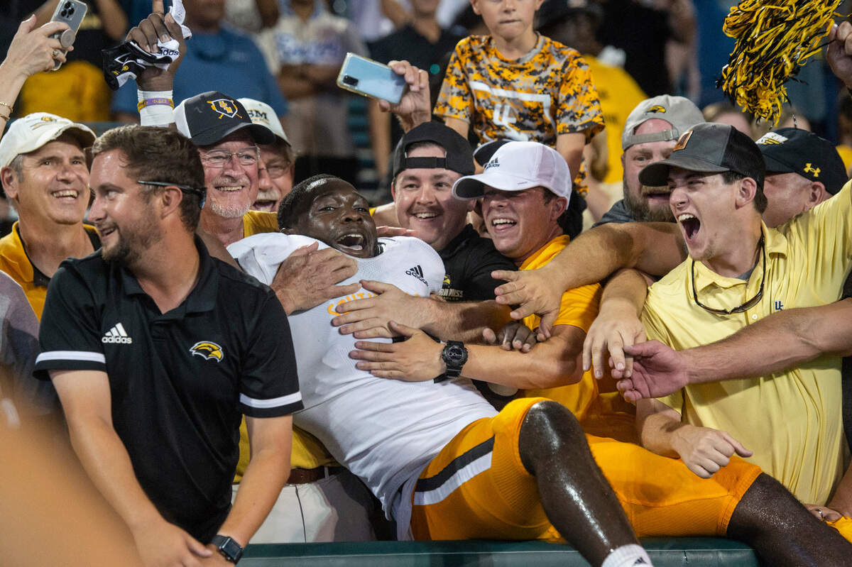 Southern Miss Golden Eagles defensive back Malik Shorts (9) jumps into the stands after a win over Tulane at Yulman Stadium in New Orleans on Saturday, Sept. 24, 2022.