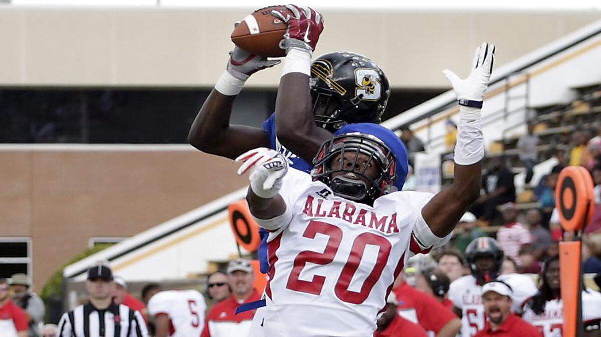 ELI BAYLIS/HATTIESBURG AMERICAN/AP 
 Starkville's A.J. Brown, top, catches a pass against Alabama during the Mississippi-Alabama Football Classic All-Star game, Dec. 12, 2015, at Southern Mississippi's M. M. Roberts Stadium in Hattiesburg. Brown is a top target for both in-state programs but could be headed to Alabama.