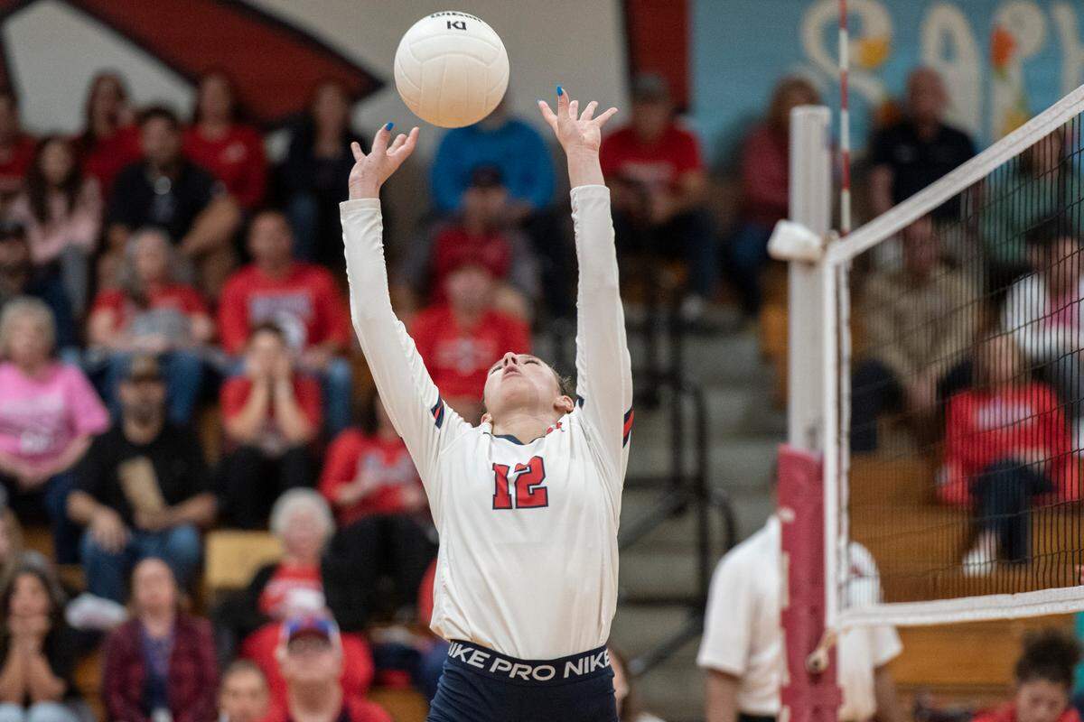 Hancock’s Anslee James sets the ball over the net during the 6A South State Championship game at Hancock High School in Kiln on Monday, Oct. 16, 2023.
