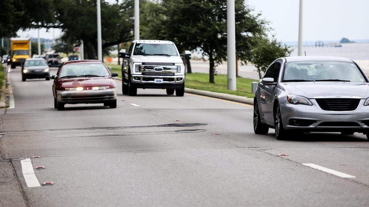 Westbound traffic flows past a section of potholes on U.S. 90 near Seashore Oaks on Monday, August 28, 2017. Mississippi Department of Transportation awarded a contract for the road along the beach to be paved from DeBuys Road to the Biloxi Bay Bridge.