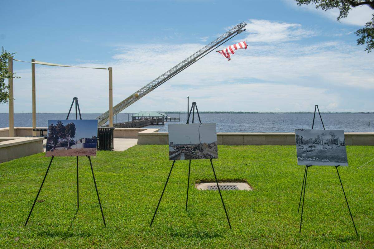Photos show some of the destruction from Hurricane Katrina during a speech on the anniversary of Hurricane Katrina at Fort Maurepas Park in Ocean Springs on Monday, Aug. 29, 2022.