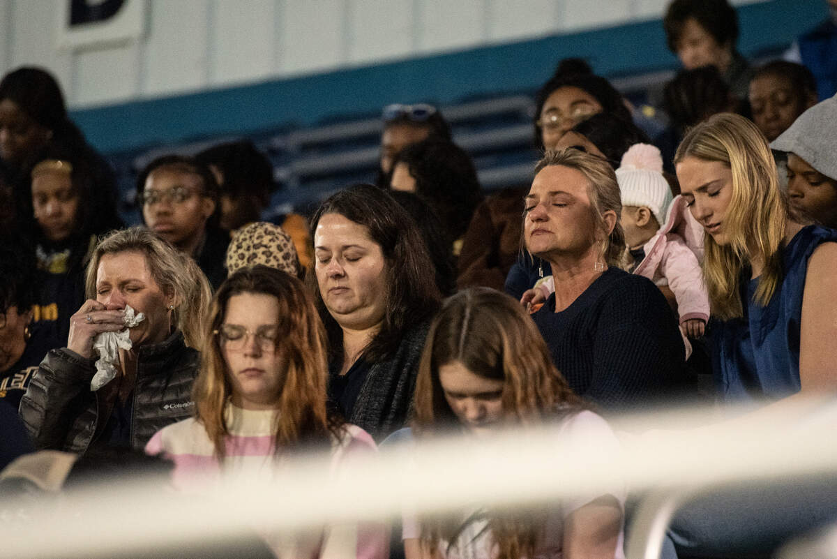 Family, friends and community members attend a candlelight vigil in honor of three Gautier High School graduates at Gautier High School in Gautier on Thursday, Dec. 7, 2023. Se’Dhari Saniya Watson-Person, Kyla “Muffin” Watkins, and Tatyanna Richmond were involved in a fatal crash on Tuesday, leading to the deaths of Watson-Person and Watkins. Richmond remains hospitalized.