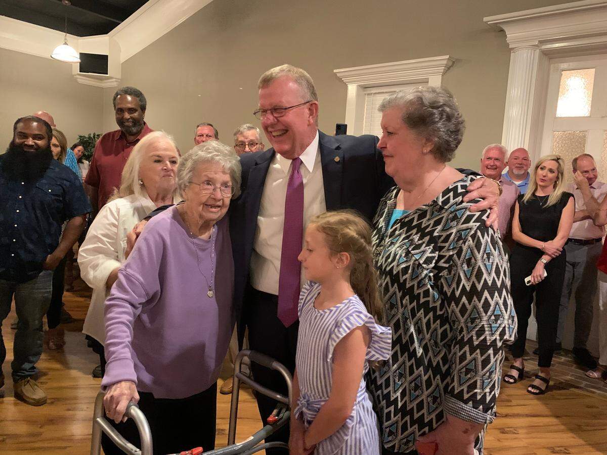 Jackson County Sheriff Mike Ezell celebrates with his 91-year-old mother, sister and granddaughter in Pascagoula on June 28, 2022.
