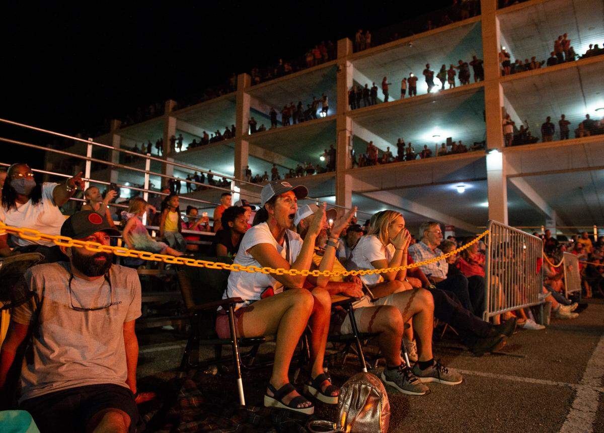 Fans cheer during the flame throwing competition, where drivers compete to see which car can produce the biggest flames, at Island View Casino in Gulfport during Cruisin’ The Coast on Tuesday, Oct. 5, 2021.