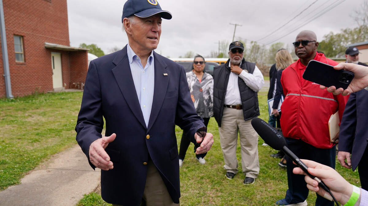 President Joe Biden speaks with members of the media after a briefing in Rolling Fork, Miss., Friday, March 31, 2023. Biden traveled Rolling Fork to survey the damage after a deadly tornado and severe storm moved through the area. Housing and Urban Development Secretary Marcia Fudge, Rep. Bennie Thompson, D-Miss., and Rolling Fork Mayor Eldridge Walker look on. (AP Photo/Carolyn Kaster)