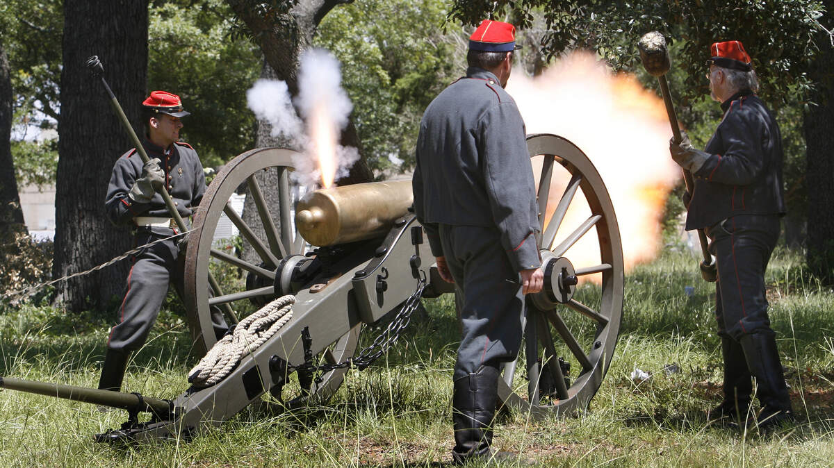 Cannons fire in sequence for a 21-gun salute to commemorate the grand opening ceremony for Beauvoir on Tuesday.