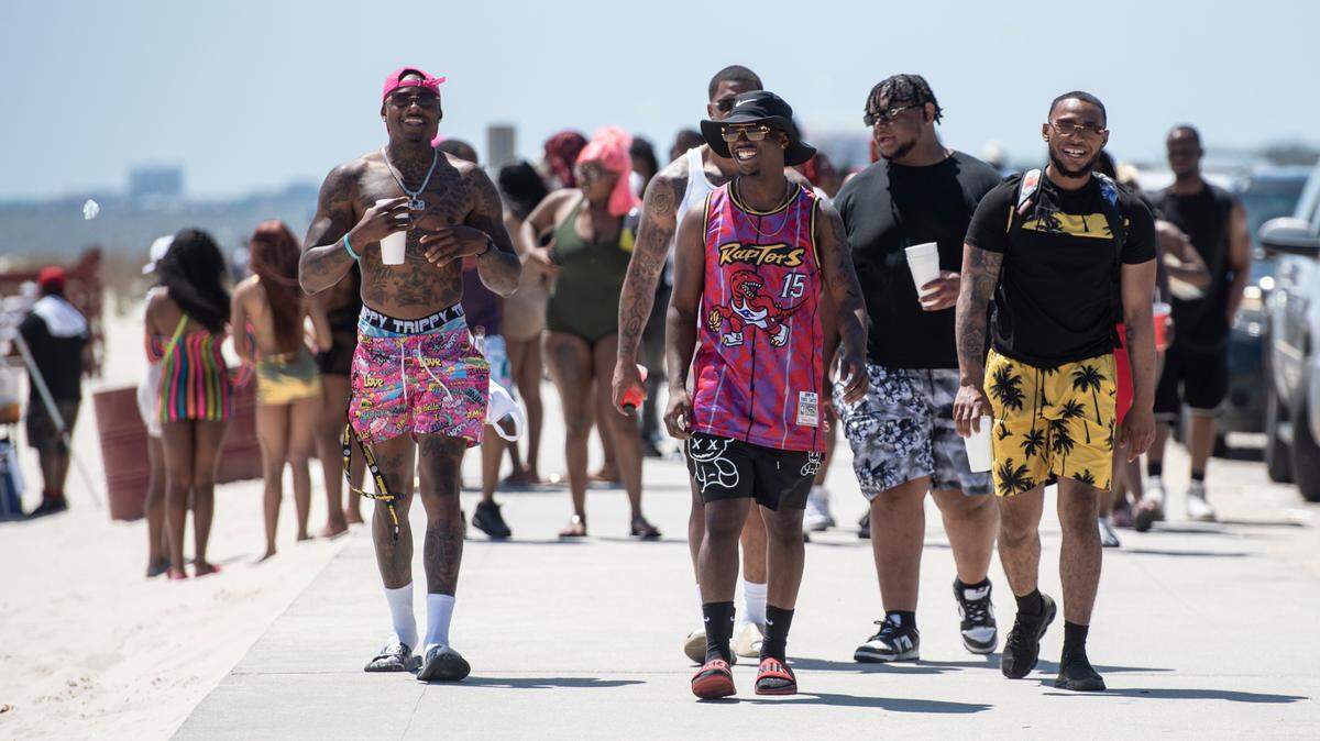 Spring breakers enjoy the weather at Biloxi Beach during Black Spring Break in Biloxi on Saturday, April 13, 2024