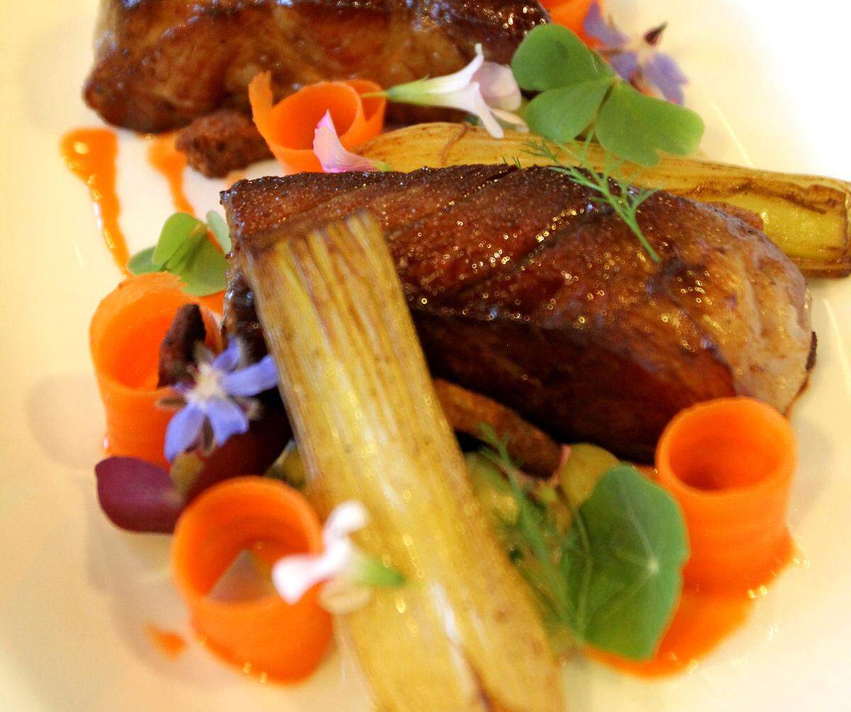 A plate of pork, carrots, butter beans and onions creates a great meal by Alex Perry of the Vestige.