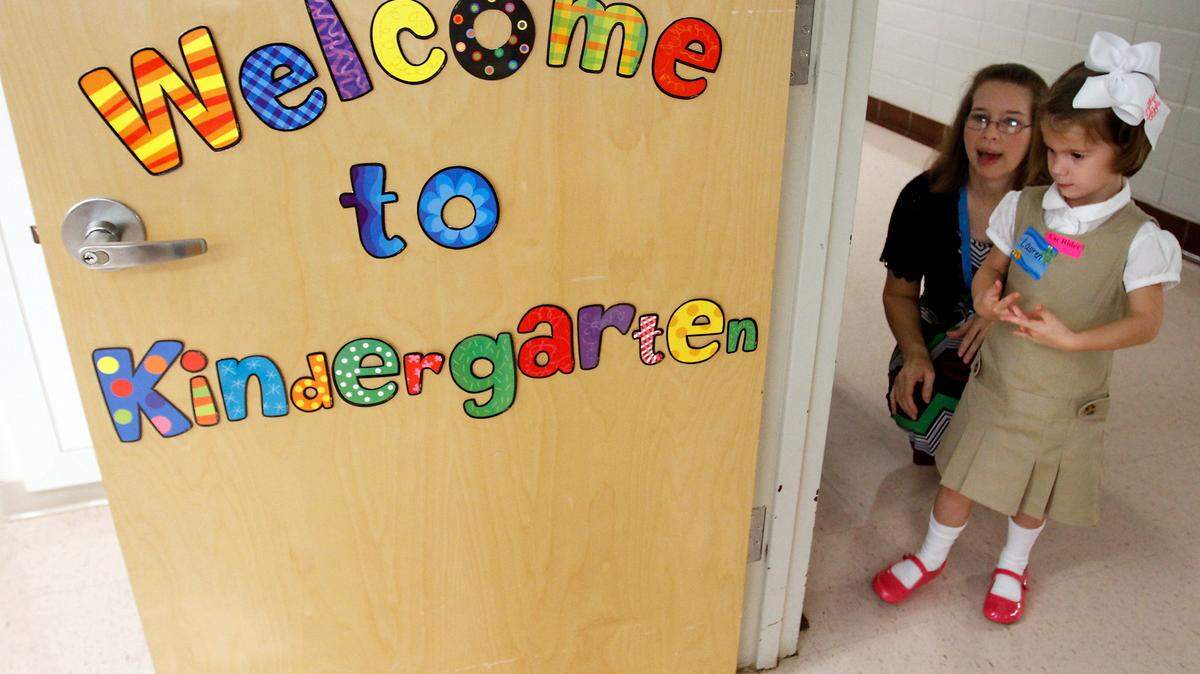 AMANDA McCOY/SUN HERALD 
 Lauren Cochran gets acquainted with her classroom with the help of her teacher Ellen Anderson on Thursday, August 8, 2013. The Mississippi Department of Education released data of kindergarten readiness on Thursday, June 16, 2016.
