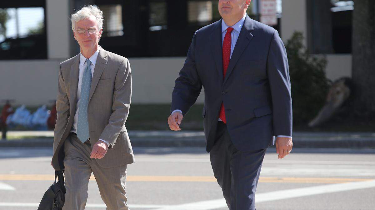 San Antonio attorney Mikal Watts, right, arriving for an October court appearance, has decided to represent himself in a BP fraud case that involves six other defendants. Watts is pictured with Robert McDuff, a prominent and well-regarded criminal-defense attorney from Jackson.