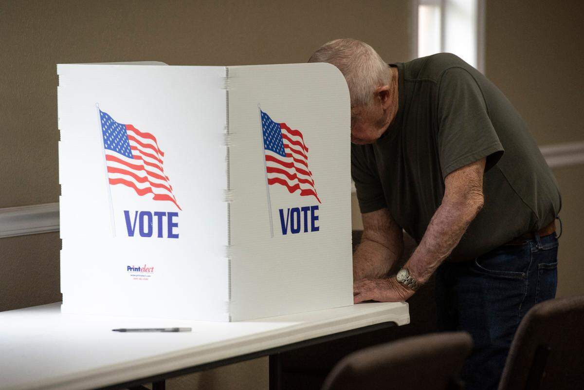 A voter casts a ballot at Grace Baptist Church in Ocean Springs during the municipal primary election on Tuesday, April 1, 2025.