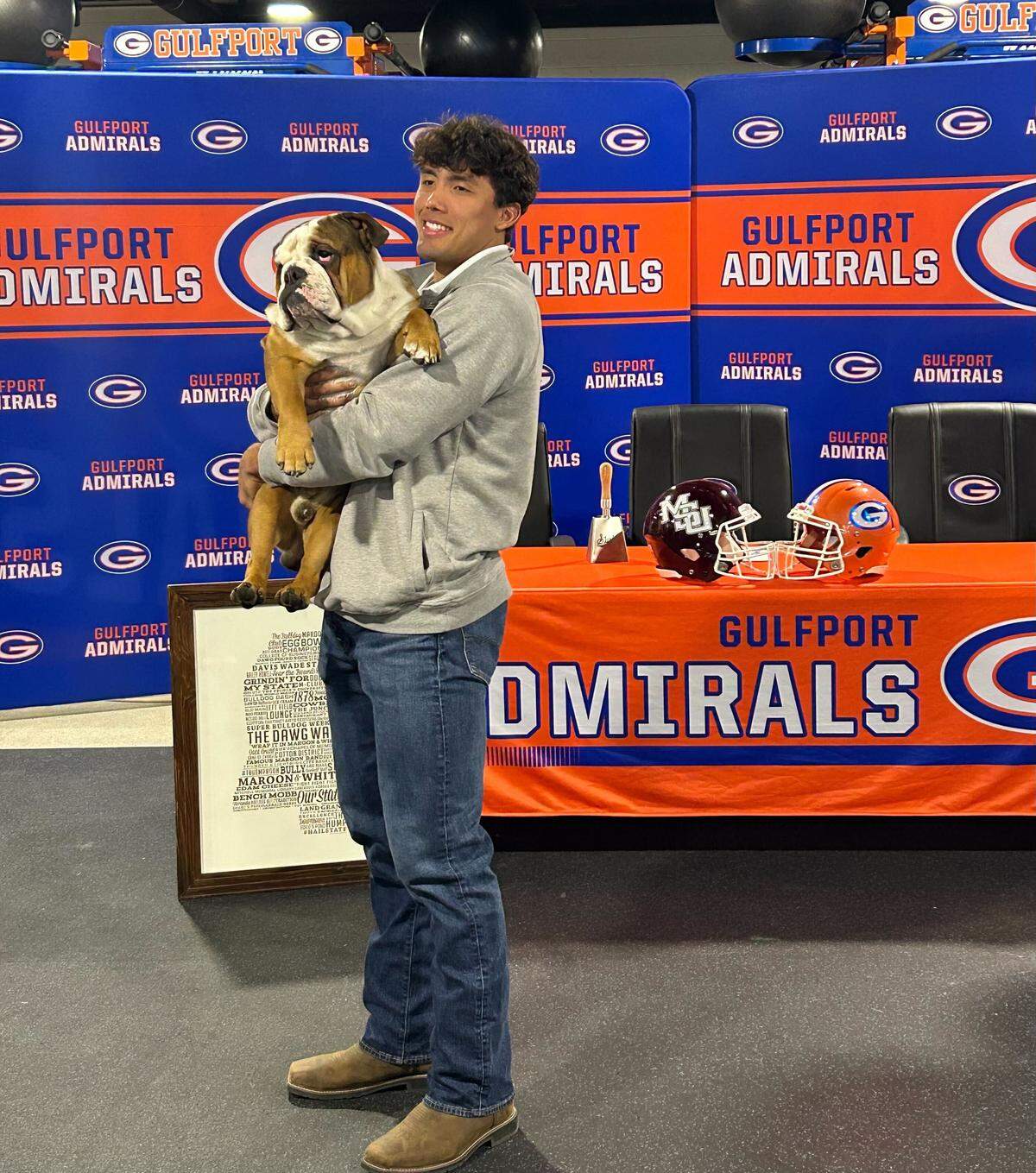 Cooper Crosby poses with a bulldog on the day of his signing with Mississippi State at Gulfport High School.