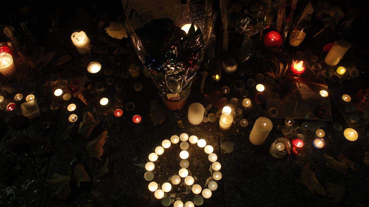 CHRISTOPHE ENA/ASSOCIATED PRESSCandles are set Tuesday in memory to the victims outside the Bataclan concert hall, one of the sites of the Nov. 13 attacks in Paris.