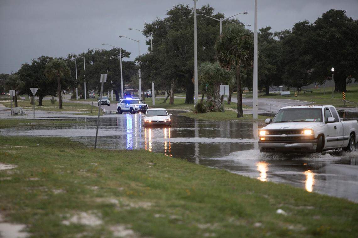 A Honda Civic car stalls out in the floodwater from Hurricane Ida at the intersection of U.S. 90 and Miramar Avenue in Biloxi on Sunday.