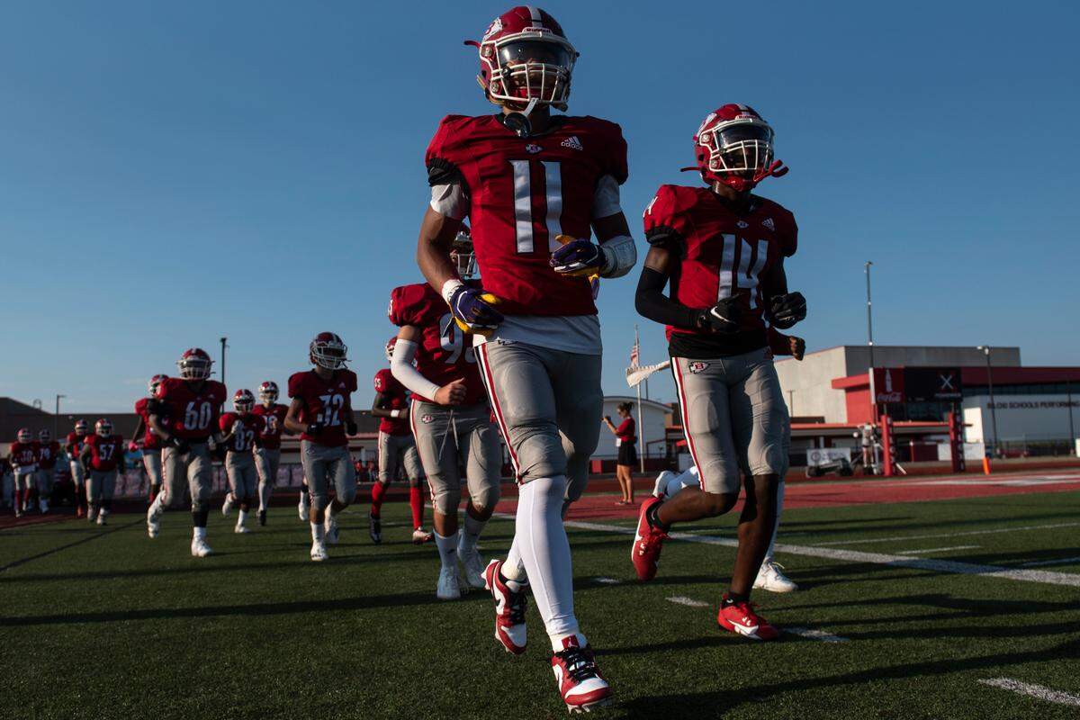 Biloxi runs onto the field before a Jamboree game at Biloxi High School on Friday, Aug. 18, 2023.