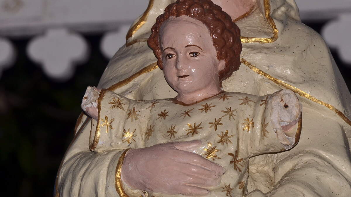 TIM ISBELL/SUN HERALD 
 A volunteer at Our Lady of the Gulf Catholic Church found the arms broken off of an infant Jesus statue on Sunday.