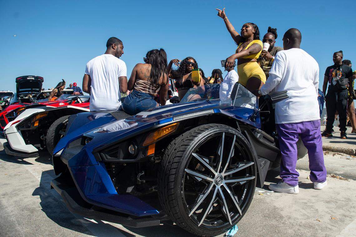 Spring breakers dance on cars during Black Spring Break in Biloxi on Saturday, April 9, 2022.