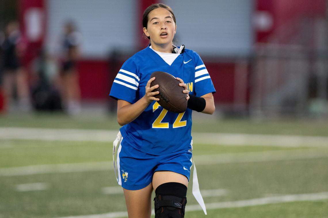 St. Martin’s Emma Chester (22) looks pass the ball during a flag football game at Harrison Central High School on Thursday, April 23, 2026.