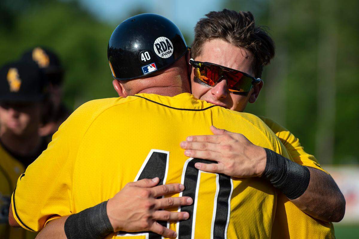 Coach Scott Berry hugs Dustin Dickerson after losing their chance at going to the College World Series during the Super Regionals Final at Pete Taylor Park in Hattiesburg on Sunday, June 12, 2022.