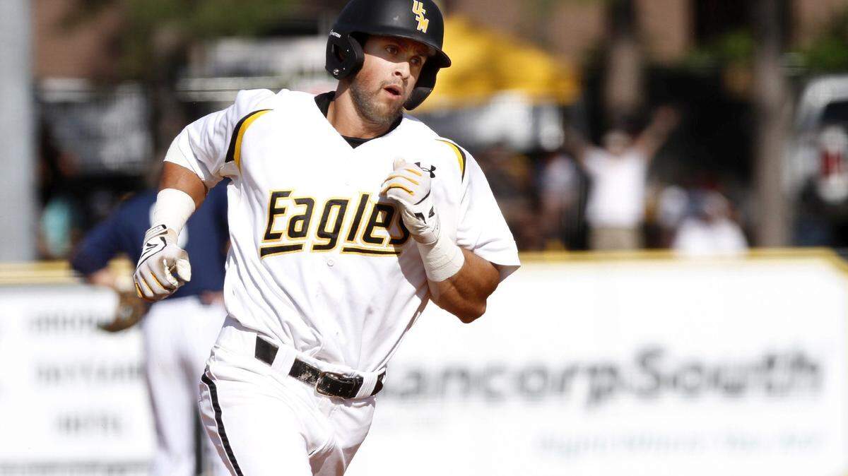TIM ISBELL/SUN HERALD 
 Southern Miss center fielder Jake Sandlin trots around the base after hitting a home run against Rice, Saturday, Apr. 23, 2016.