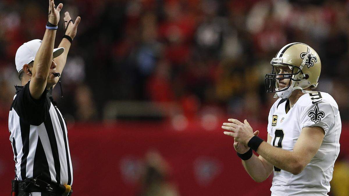New Orleans Saints quarterback Drew Brees (9) calls for a time out during the first half of an NFL football game against the Atlanta Falcons, Sunday, Jan. 3, 2016, in Atlanta. (AP Photo/Butch Dill)