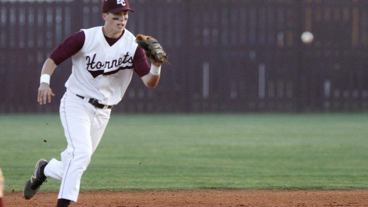 TIM ISBELL/SUN HERALD 
 East Central shortstop Reis Trager charges a ground ball against Vancleave, Friday, Apr. 8, 2016.