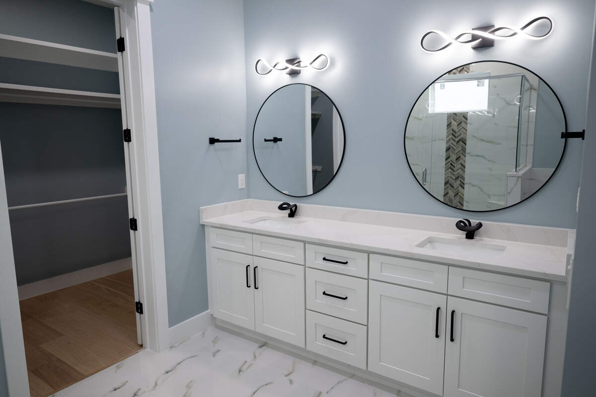 The master bathroom and the entrance to a walk-in closet inside a house for sale at 1855 Beach Boulevard in Biloxi on Tuesday, February. 3, 2026.