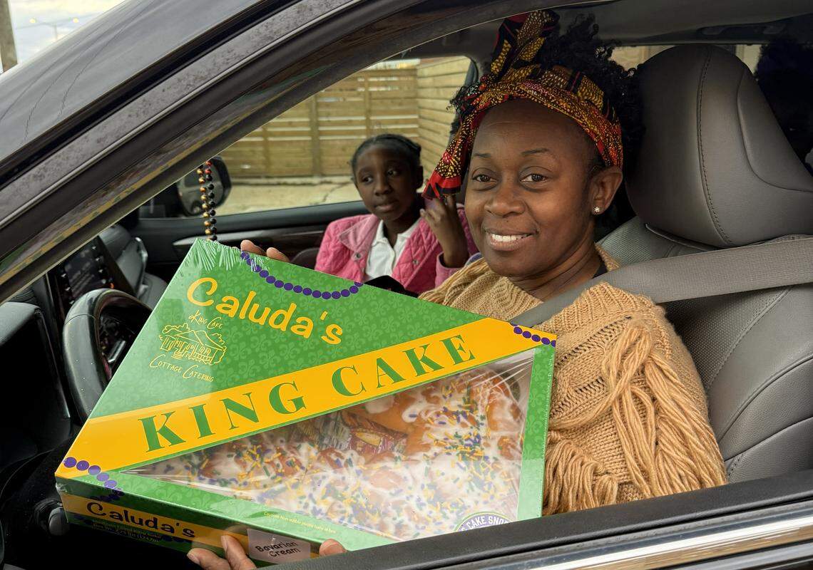 A customer scores a king cake from Claudia’s at the king cake drive-thru in Bay St. Louis in 2025. The event returns this year.