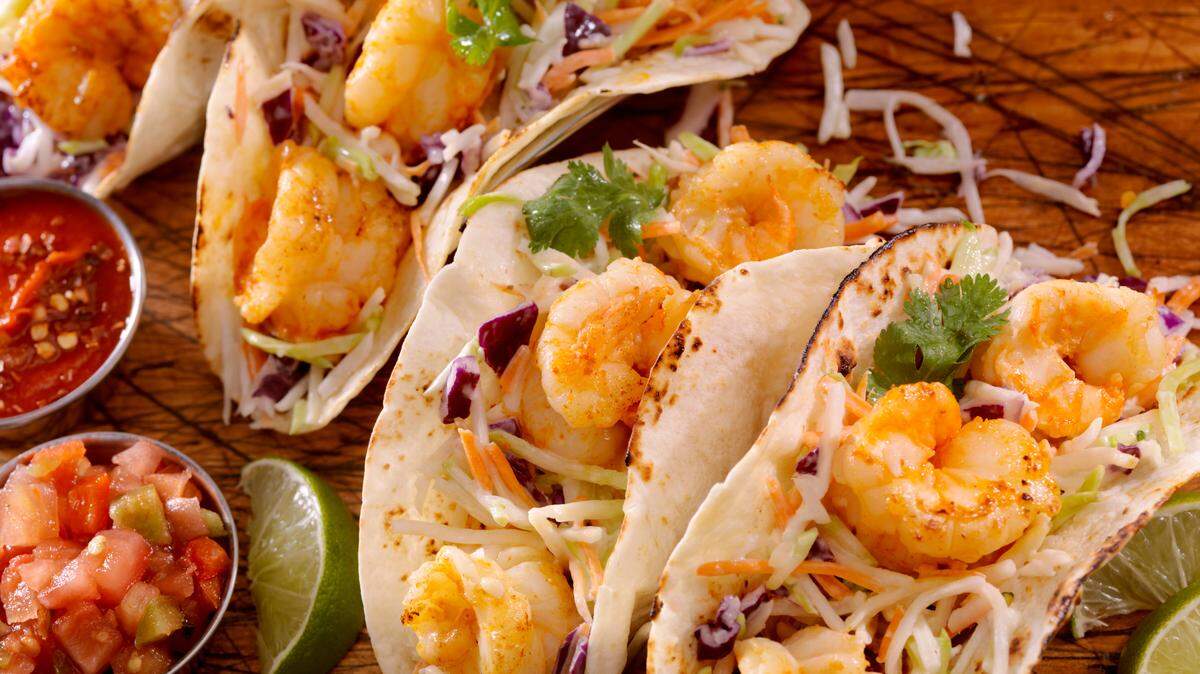 Shrimp quesadillas can be prepared a variety of ways, including with a slaw mix as pictured above or with hummus, artichoke hearts and feta cheese as the Cooks Exchange recipe suggests.