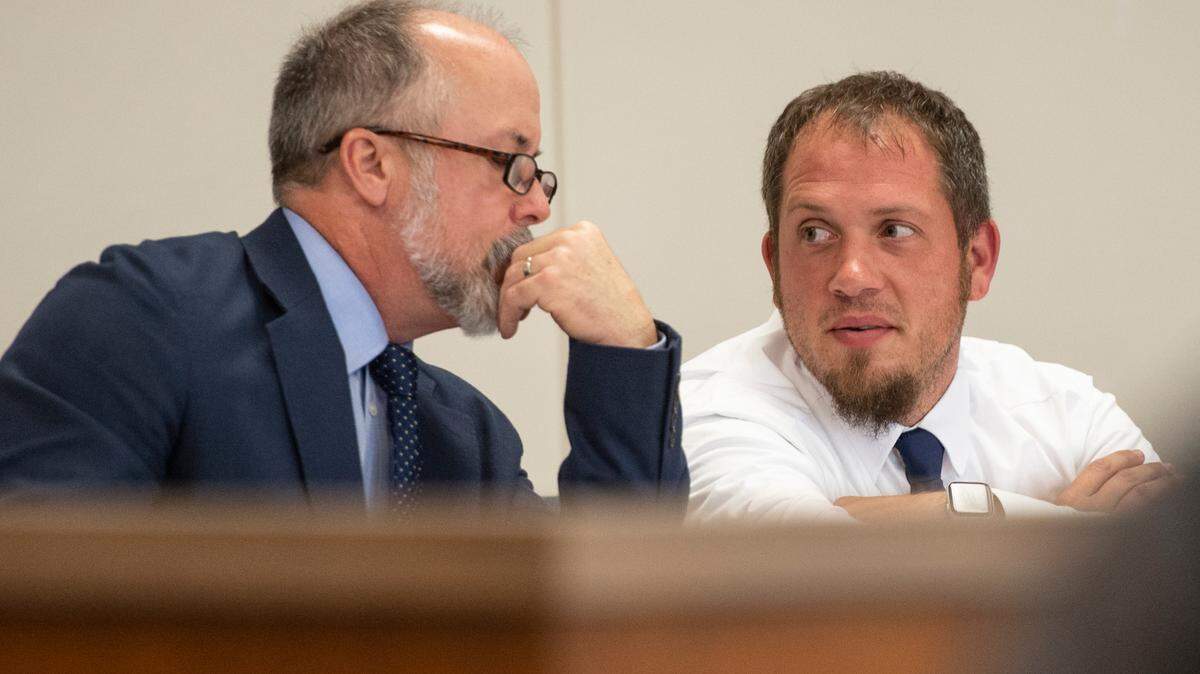 Ryan Brashear speaks with his attorney during a trial at the Harrison County Courthouse in Biloxi on Tuesday, March 28, 2023.