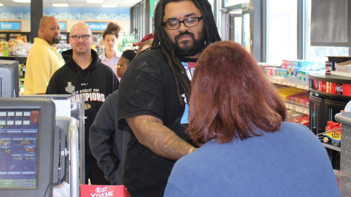 JEFF CLARK/SUN HERALD 
 Malcolm Drake of Ocean Springs buys his Powerball tickets at a RaceTrac gas station in Slidell Tuesday morning in hopes of winning more than $1 billion dollars.