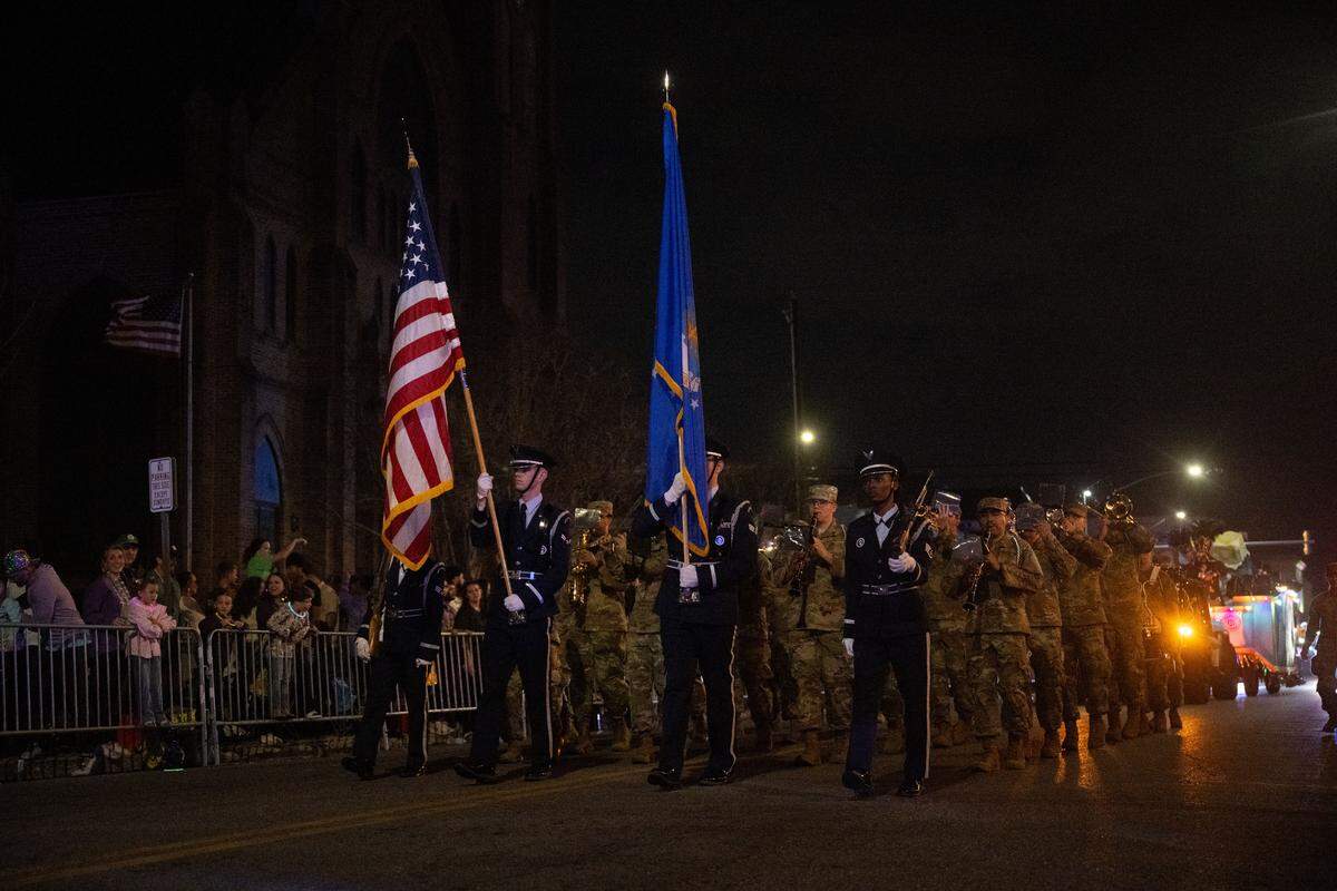 U.S. soldiers march down Howard Avenue during the Krewe of Neptune parade in Biloxi on Saturday, Feb. 14, 2026.
